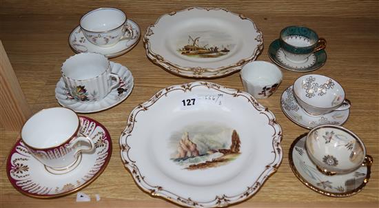 A 19th century plate with a hand painted scene of Freshwater Bay, Isle of Wight, two others and various cabinet cups and saucers